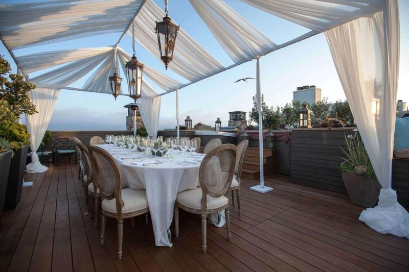 A dinner table set for 20 on rooftop in Malibu for a high profile client's birthday party.